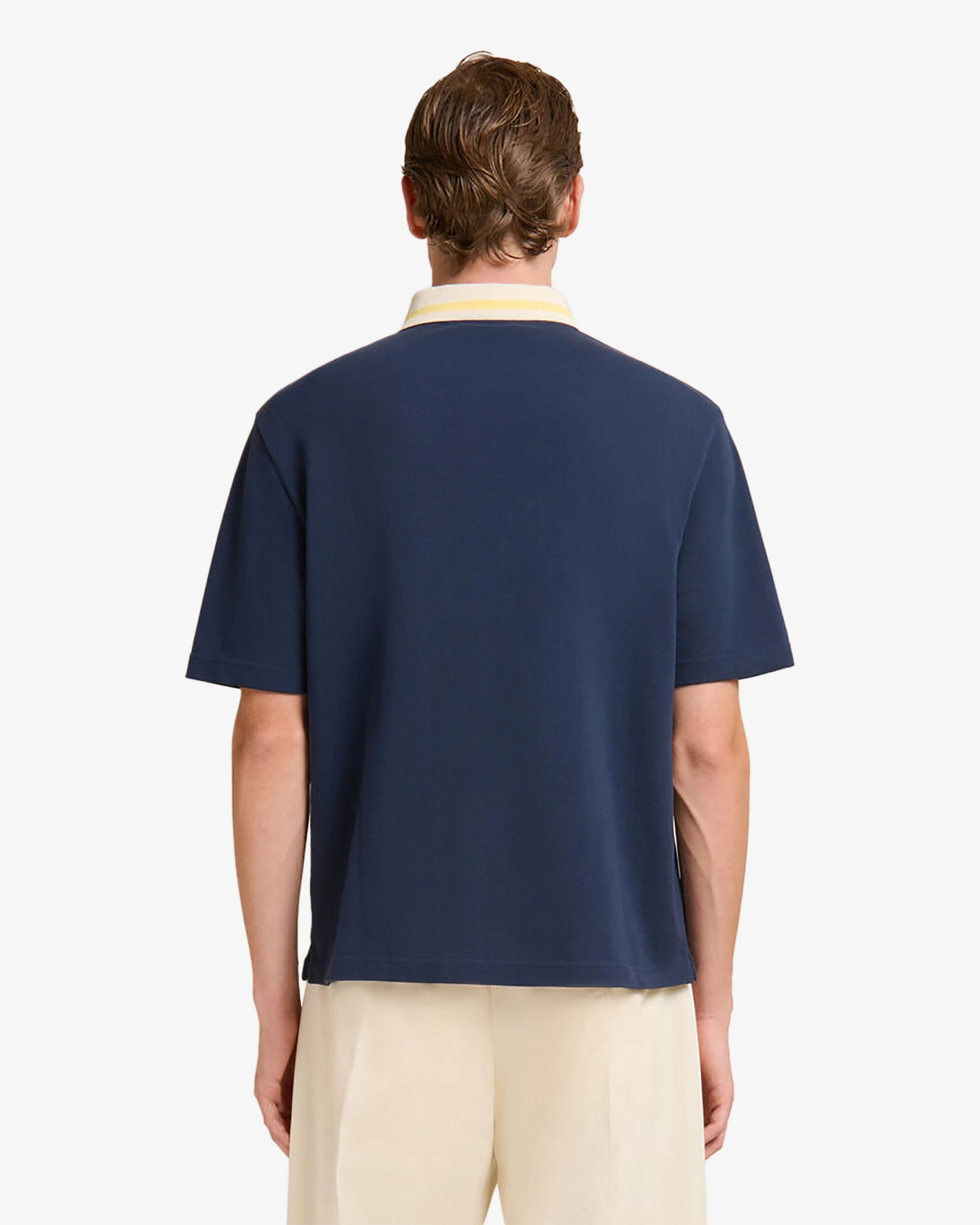 Polo in piqué blu scuro con colletto a righe